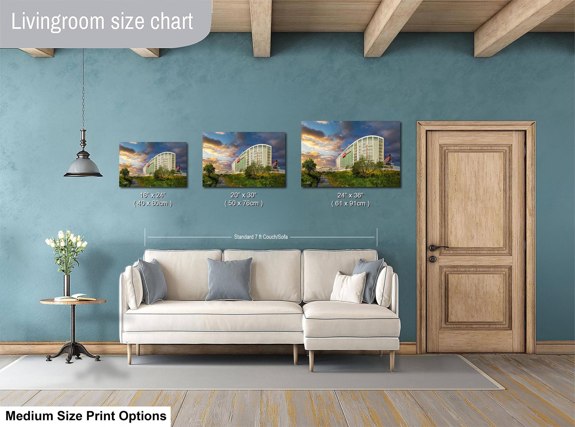 The image is a livingroom size chart with three framed prints of a building, likely a hotel, displayed on the wall. The prints vary in size, ranging from 10x14 inches to 24x36 inches. The livingroom itself includes a white sofa and a wooden door, creating a cozy and inviting atmosphere.