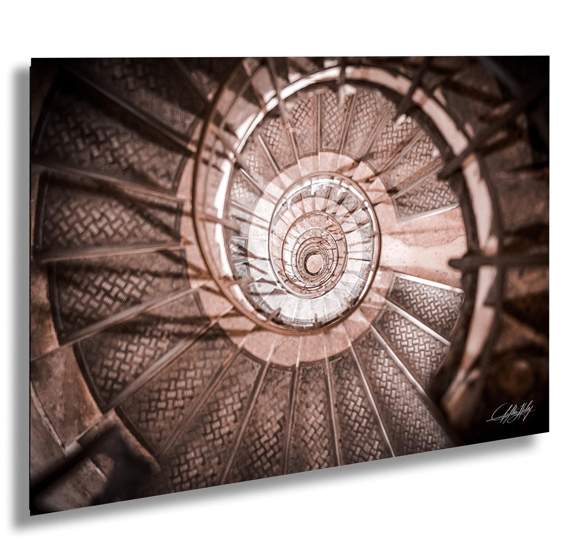 a spiral staircase with intricate patterns and designs, creating a visually captivating and mesmerizing effect.