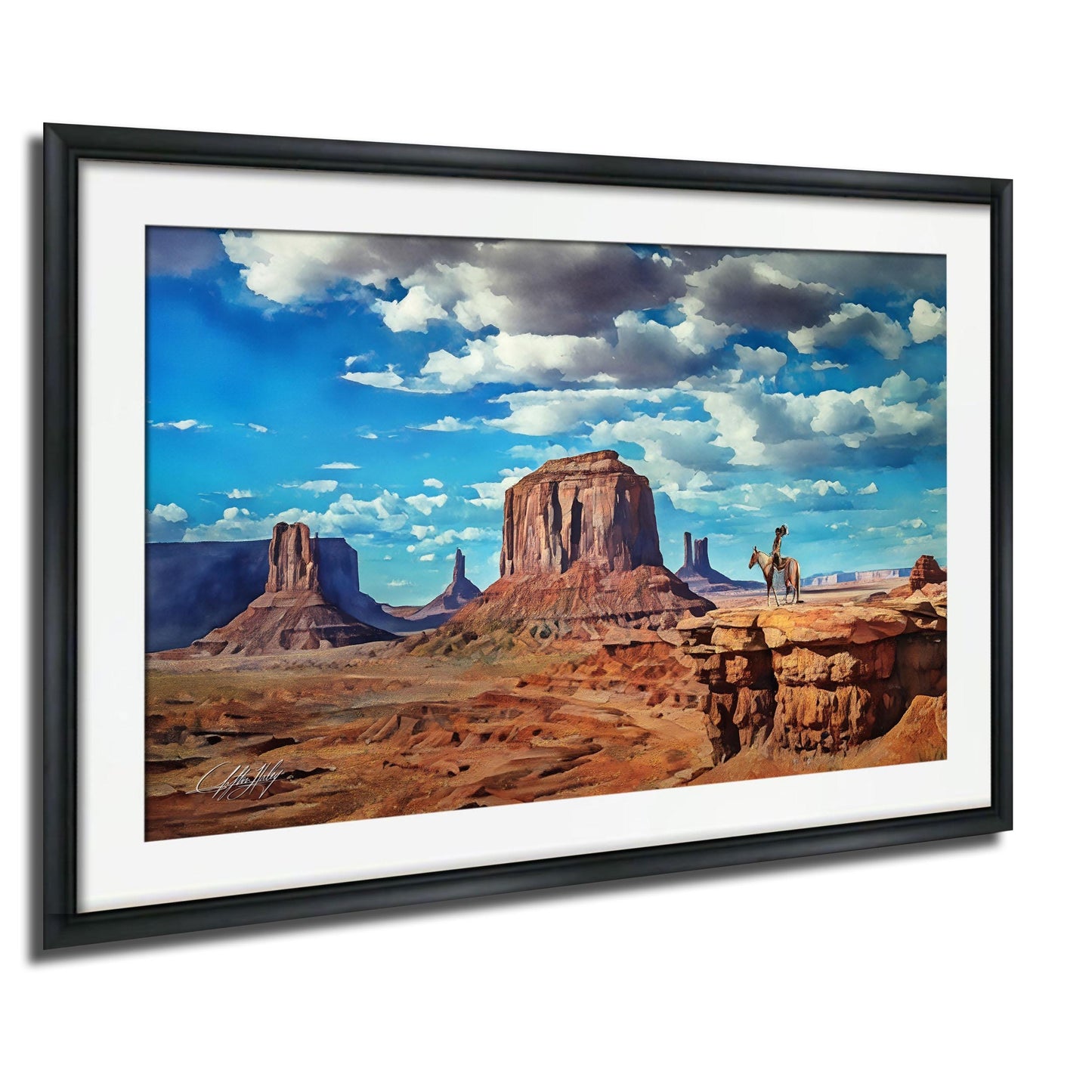 A framed painting depicting a scenic desert landscape with towering rock formations, a person riding a horse, and a cloudy blue sky.