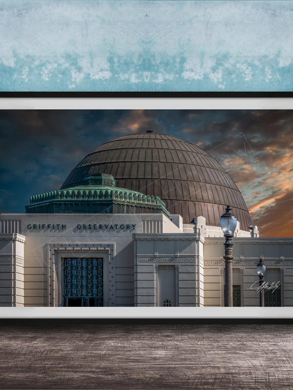 the Griffith Observatory, a large domed building with a distinctive architectural style, set against a dramatic sky with clouds and a sunset.