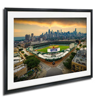 The image is a framed aerial view of a baseball stadium in Chicago, Illinois, with the city skyline in the background.