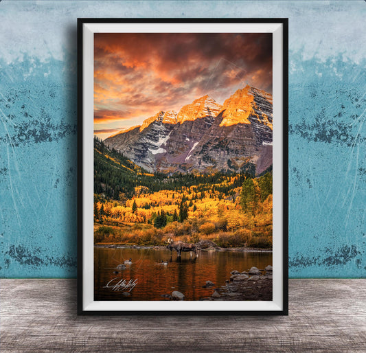 a breathtaking mountain landscape with a vibrant sunset sky, casting a warm glow over the snow-capped peaks and the surrounding forest.