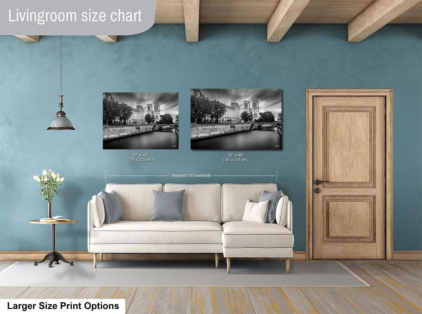 a living room with a white sofa, a wooden door, and a painting of a cityscape on the wall.