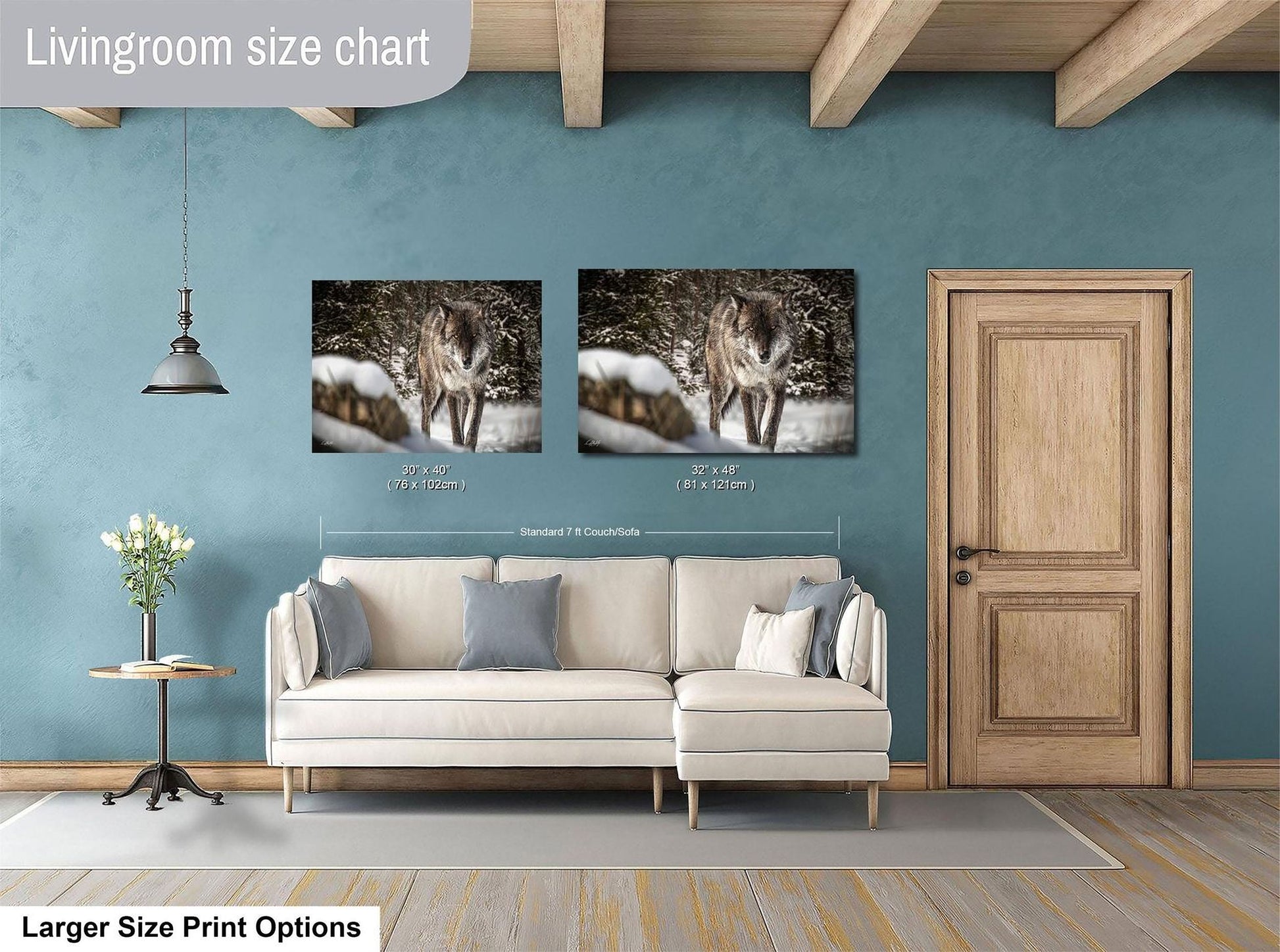 a living room with a white sofa, a wooden door, and two framed photographs of a wolf on the wall.