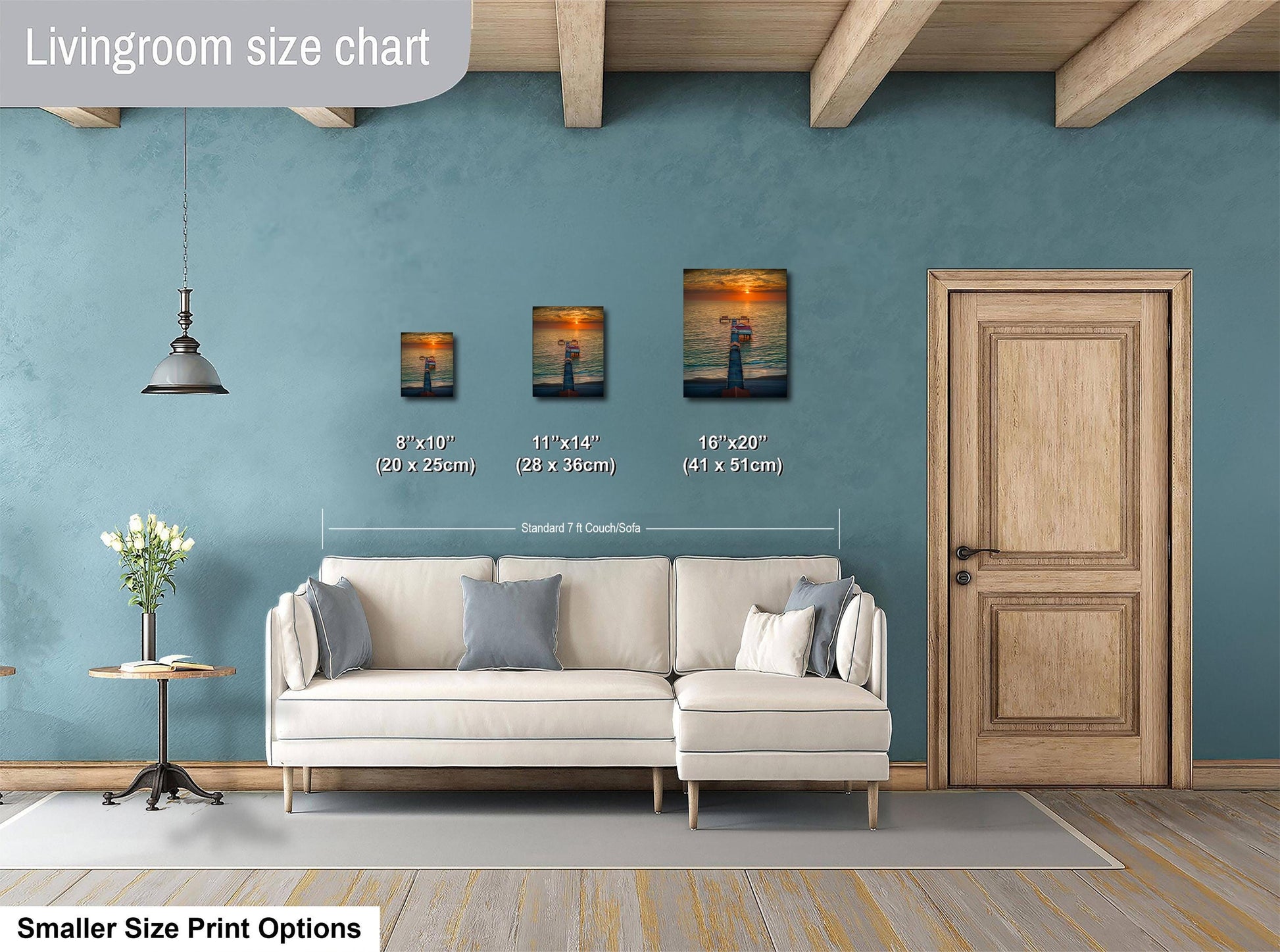 a living room with a white sofa, a wooden door, and a painting on the wall. The painting is of a sunset over the ocean. The living room appears to be designed for relaxation and comfort, with a cozy atmosphere.