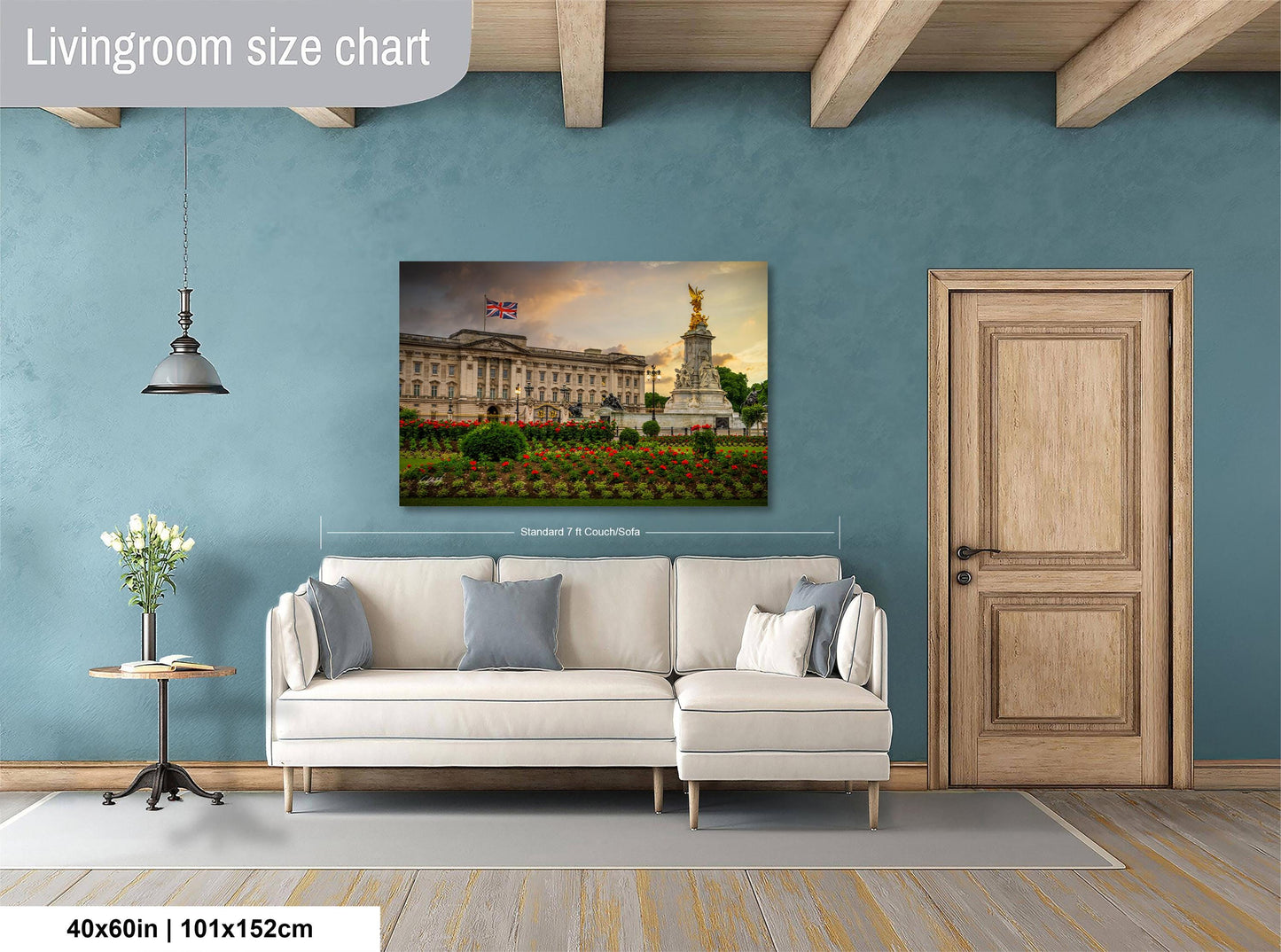 a living room with a large painting of a building and a statue on the wall, a white sofa, and a wooden door.