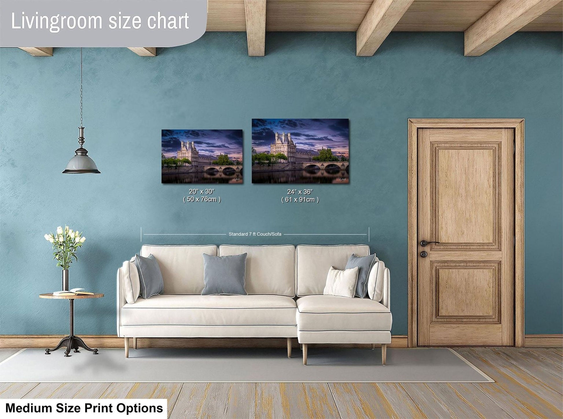 a living room with a white sofa, a wooden door, and a painting of a cityscape on the wall. The painting is of a medium size, and the living room appears to be designed for a comfortable and relaxing atmosphere.