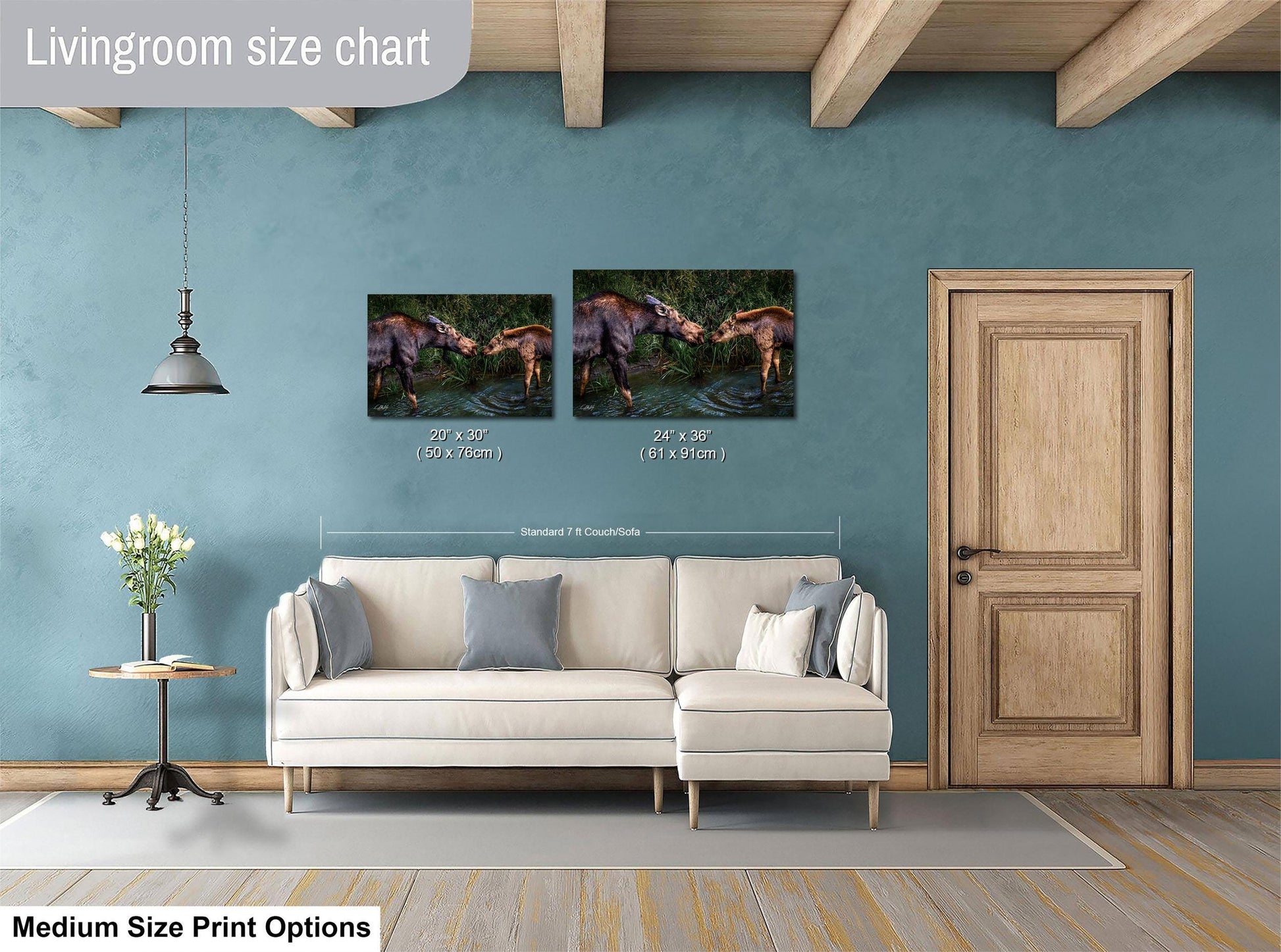 a living room with a white sofa, a wooden door, and a painting of two animals on the wall. The painting is of a moose and a bear, and it is described as a medium-sized print.
