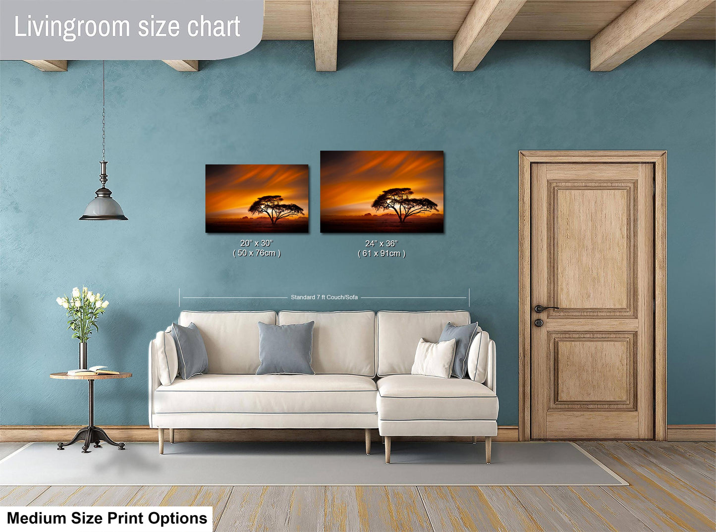 a living room with a white sofa, a wooden door, and a painting of a tree on the wall. The painting is of a sunset, and the sofa is positioned in front of it. The living room appears to be well-lit and decorated, with a potted plant and a vase adding to the ambiance.