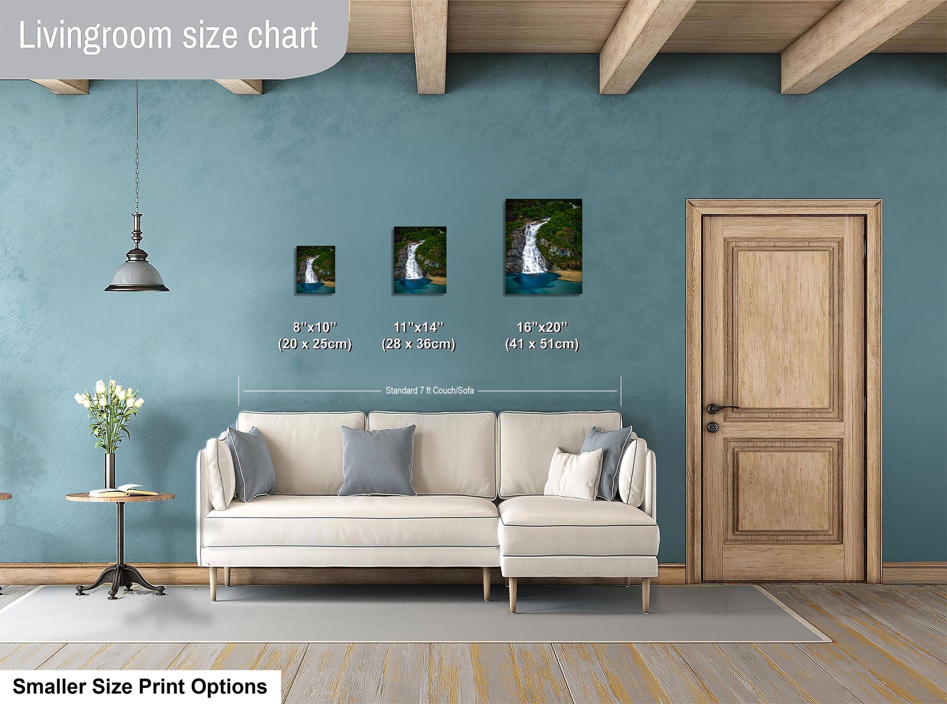 a living room with a white sofa, a wooden door, and a hanging light fixture. There are three framed pictures of waterfalls displayed on the wall, each with a different size and height. The living room appears to be designed for relaxation and comfort, with a focus on the artwork and the overall aesthetic.