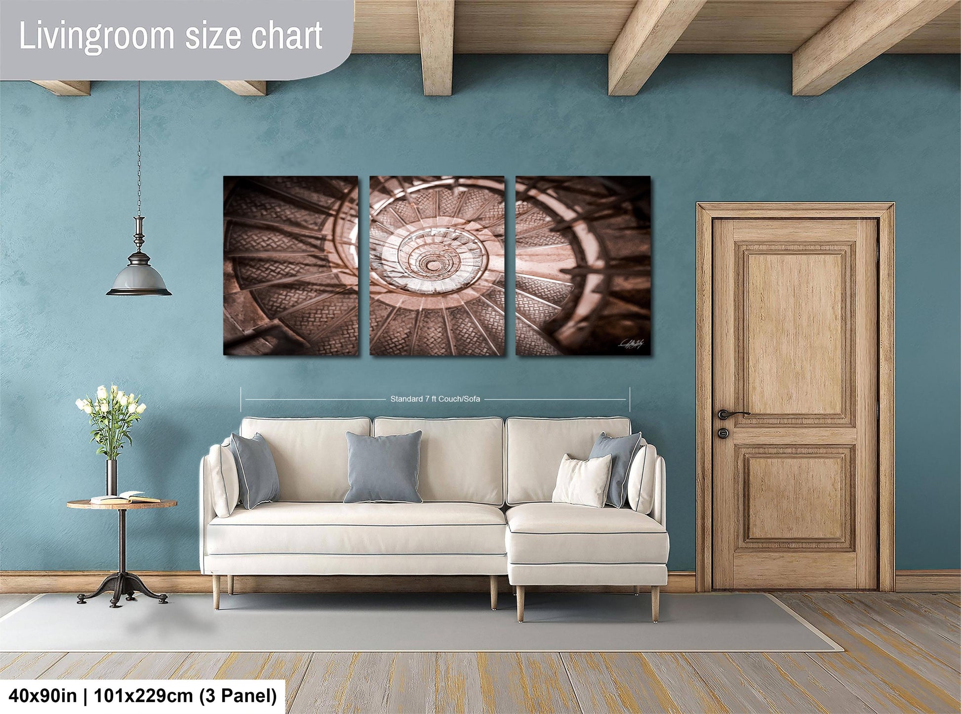 The image is a living room with a white sofa, a wooden door, and a painting of a spiral staircase on the wall.