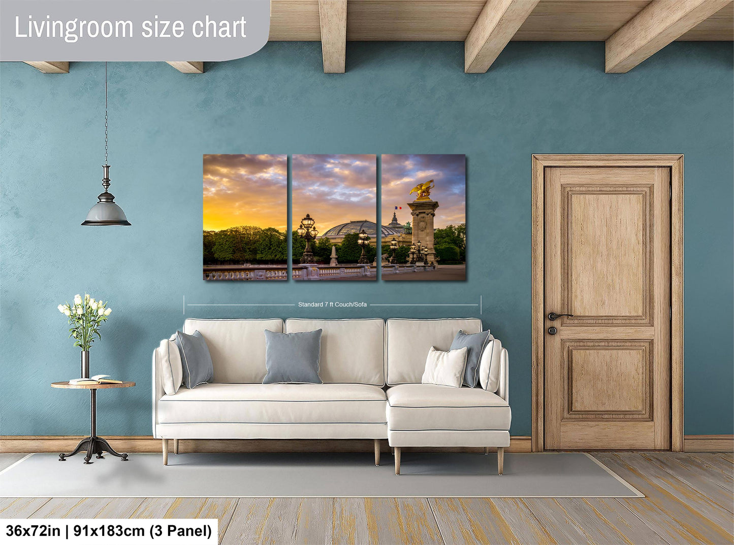 The image is a living room with a large, three-panel living room size chart on the wall. The chart displays the dimensions of the living room in both square feet and square meters. The living room features a white sofa, a wooden door, and a small table with a vase of flowers.