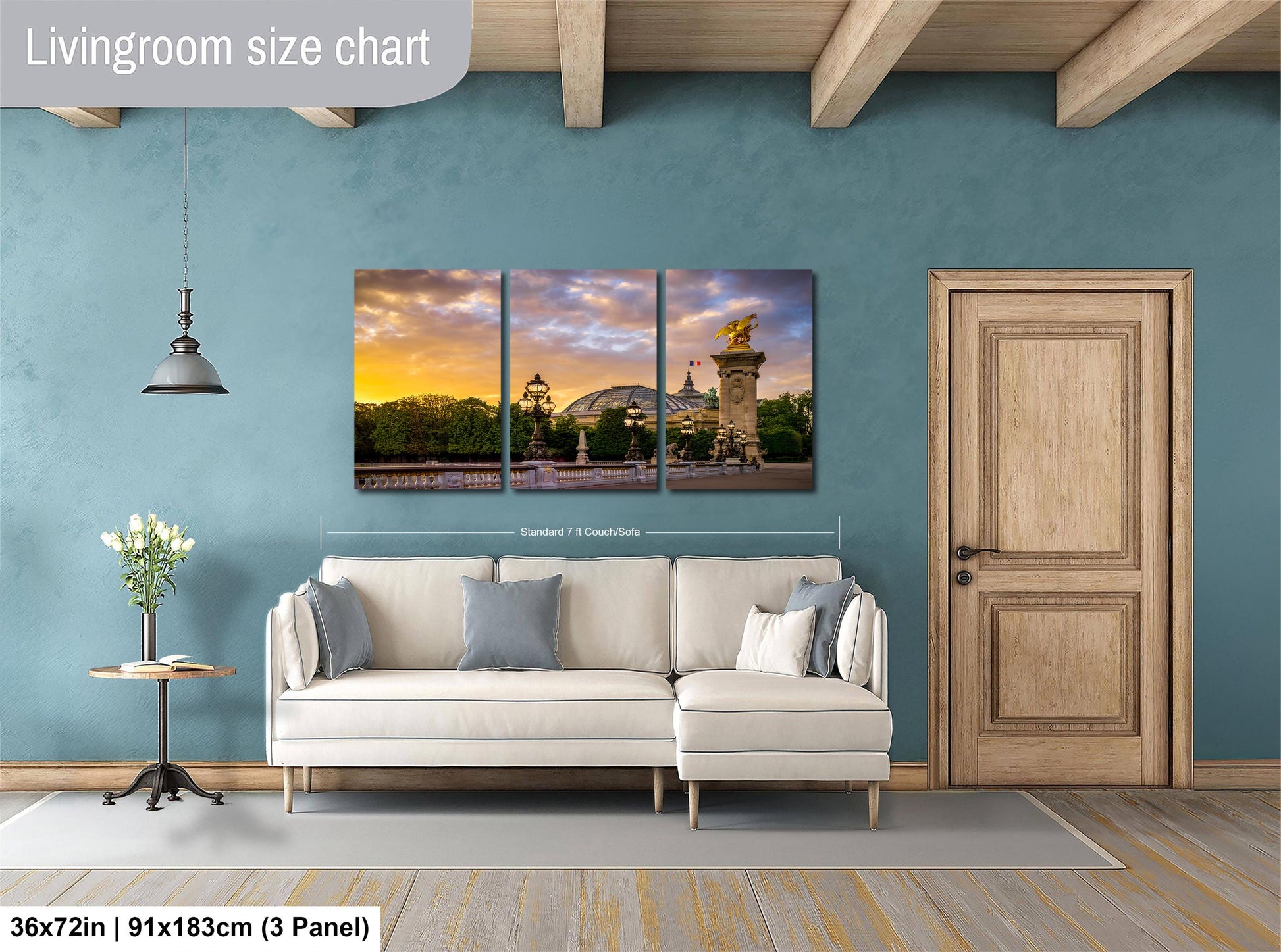 The image is a living room with a large, three-panel living room size chart on the wall. The chart displays the dimensions of the living room in both square feet and square meters. The living room features a white sofa, a wooden door, and a small table with a vase of flowers.