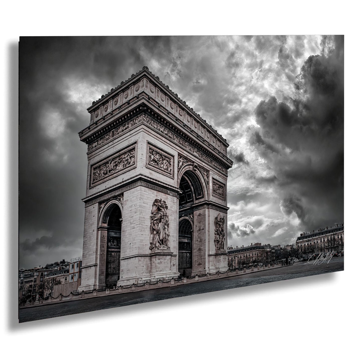 a large, ornate archway with intricate carvings and sculptures, set against a dramatic cloudy sky.
