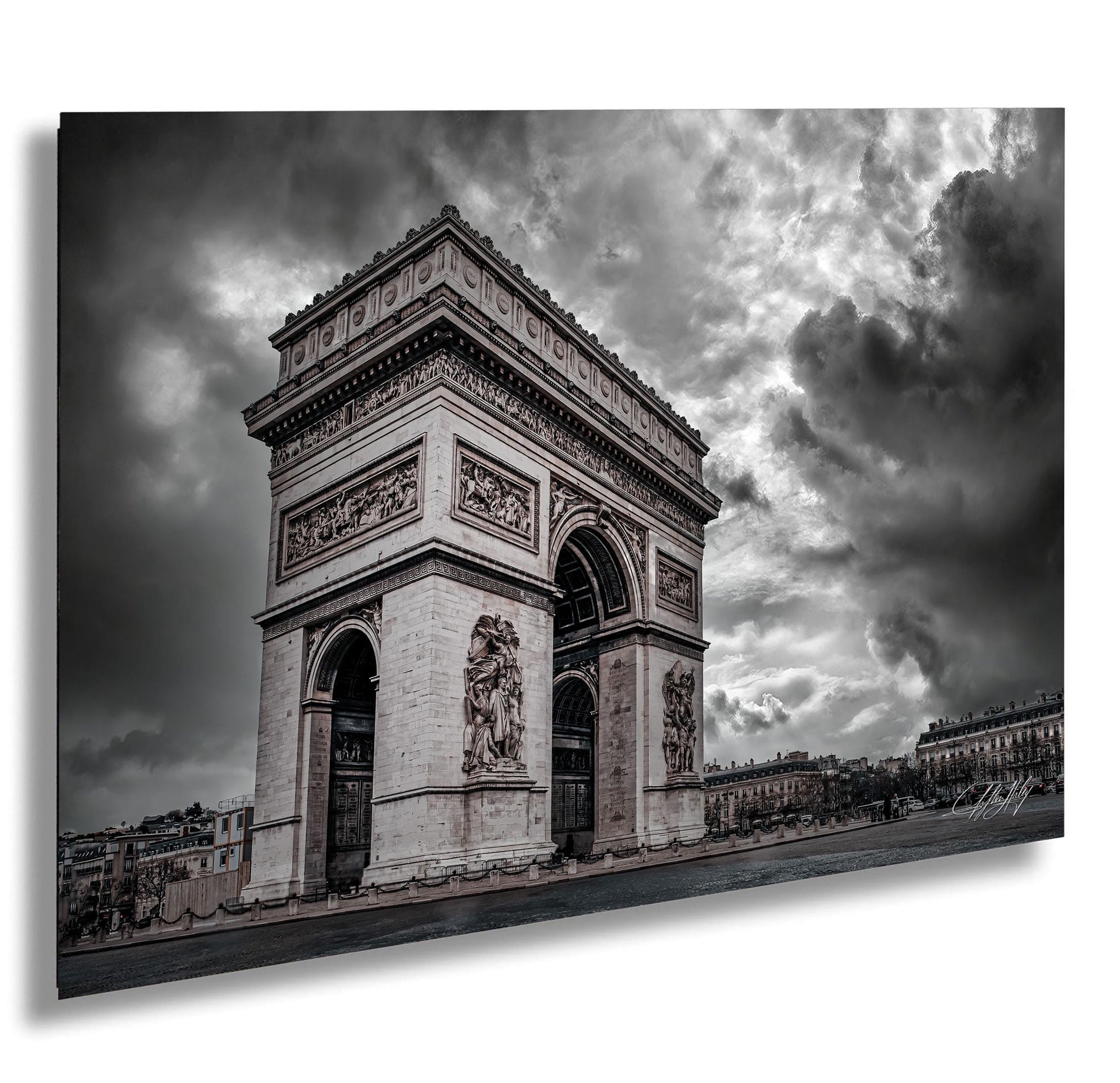 a large, ornate archway with intricate carvings and sculptures, set against a dramatic cloudy sky.