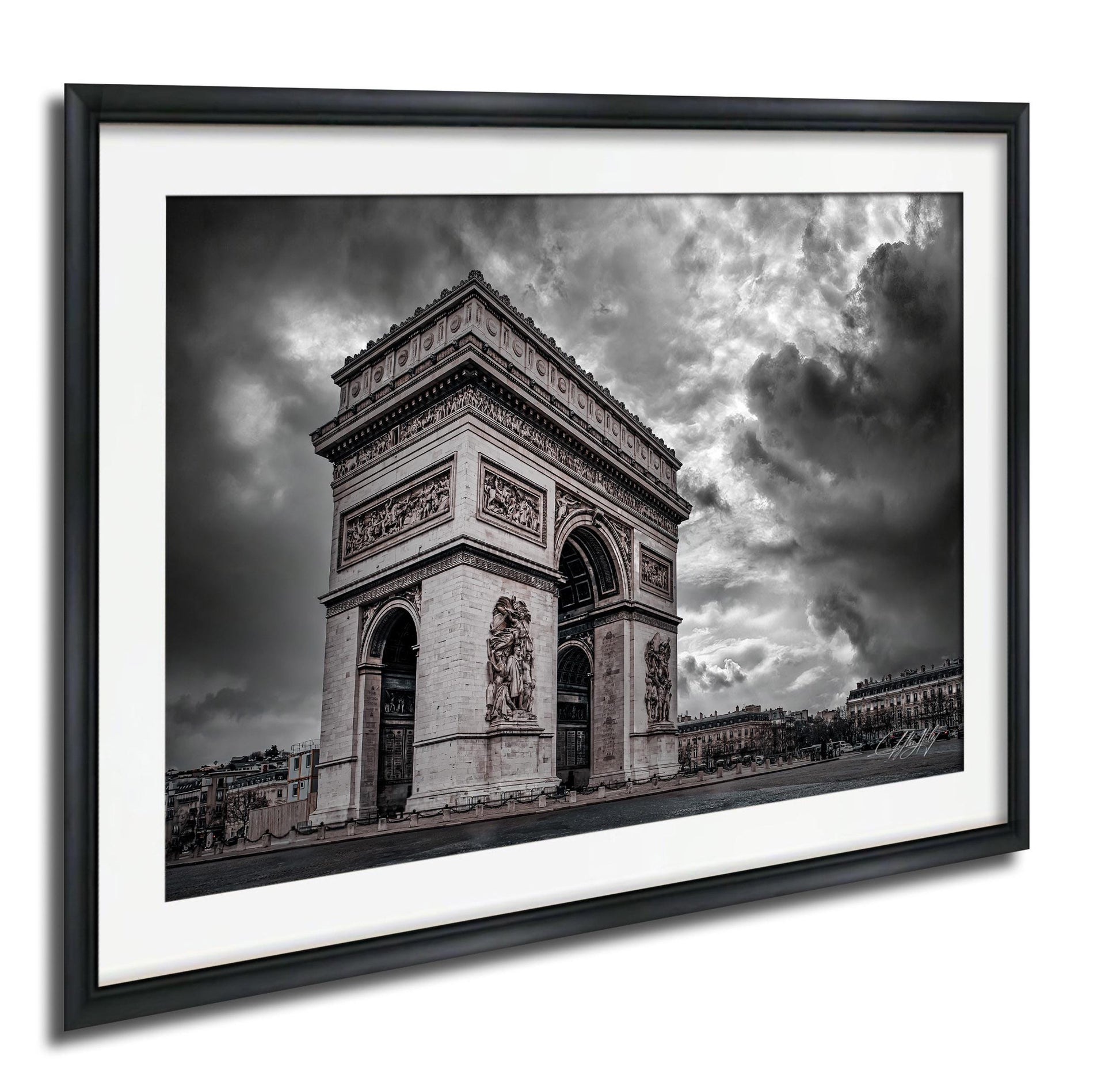 The image is a black and white photograph of the Arc de Triomphe in Paris, France, with dramatic clouds in the background.