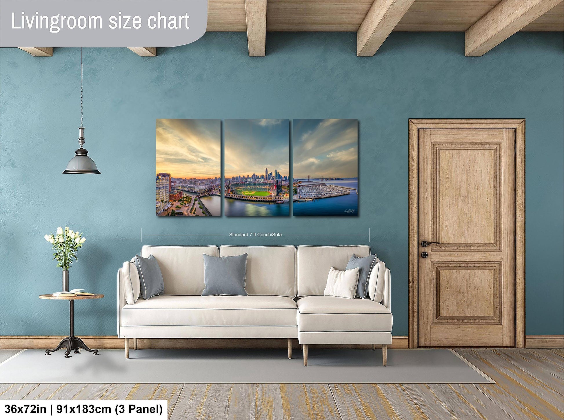 The image is a living room with a large, three-panel living room size chart on the wall. The chart provides dimensions for the living room, including the width and height. The living room is furnished with a white sofa and a wooden door, and there is a vase of flowers on a table nearby.