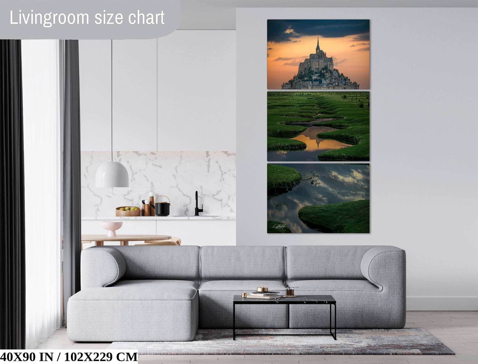 The image is a living room with a gray sofa, a coffee table, and a large wall art depicting a castle in a field.