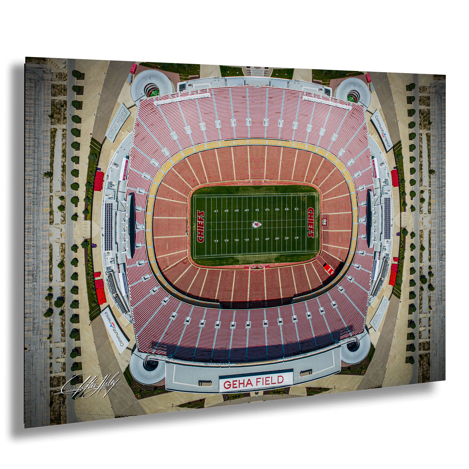The image is an aerial view of a football stadium, specifically Kansas City Chiefs Stadium, with the football field prominently displayed in the center.