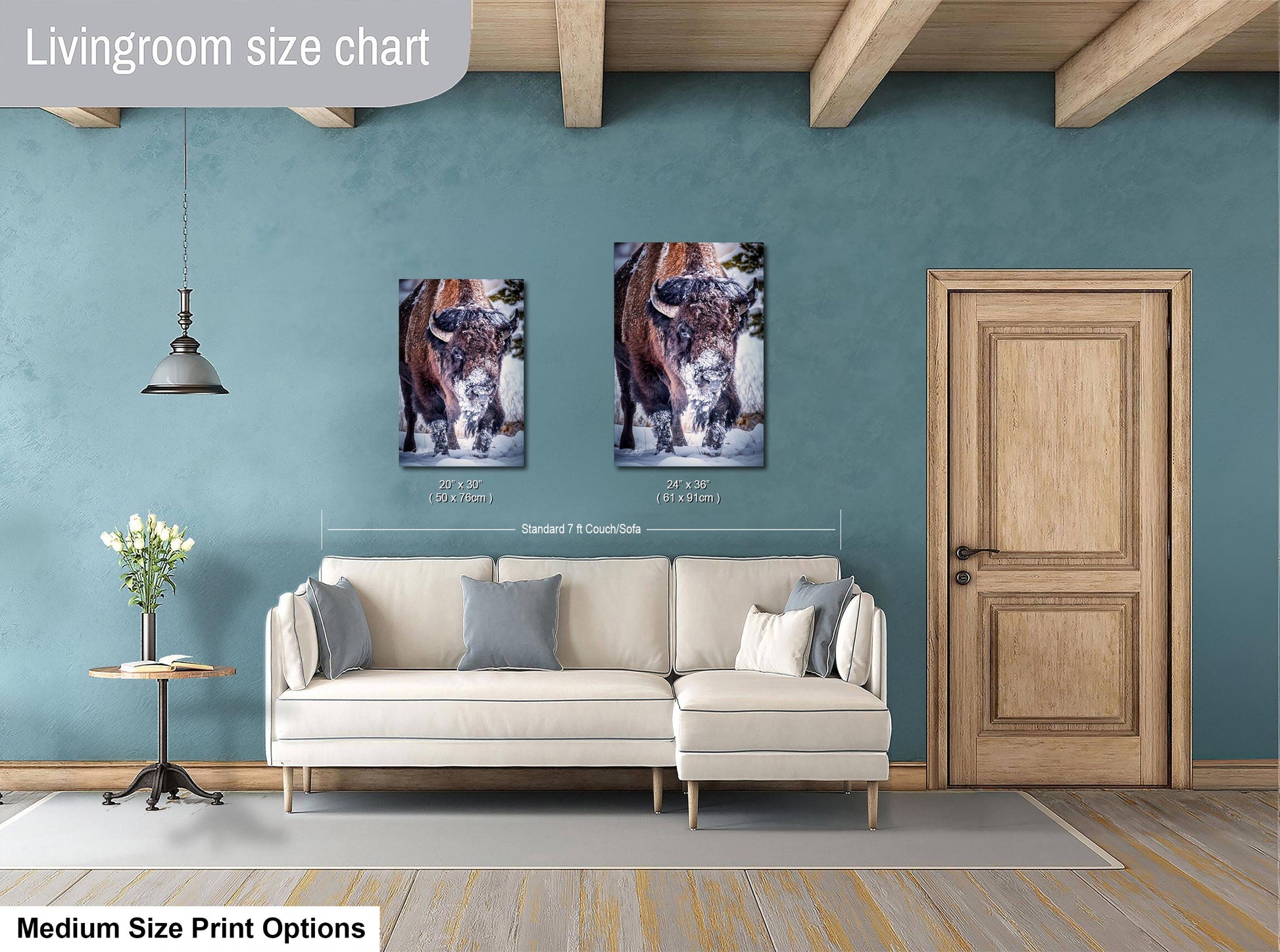 a living room with a couch and two pictures on the wall