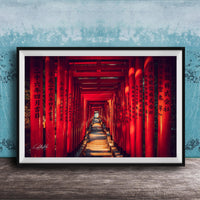 A framed photograph depicting a long, narrow red tunnel or walkway with Chinese characters on the walls, leading towards a light source at the end.