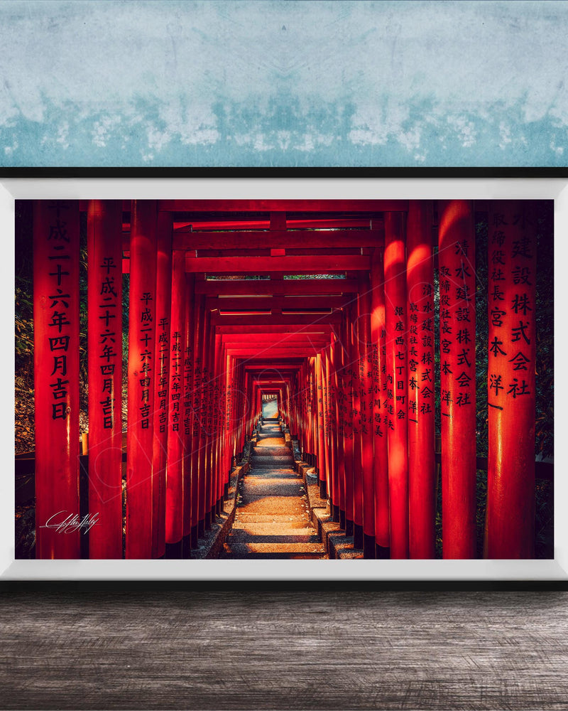 A framed photograph depicting a long, narrow red tunnel or walkway with Chinese characters on the walls, leading towards a light source at the end.